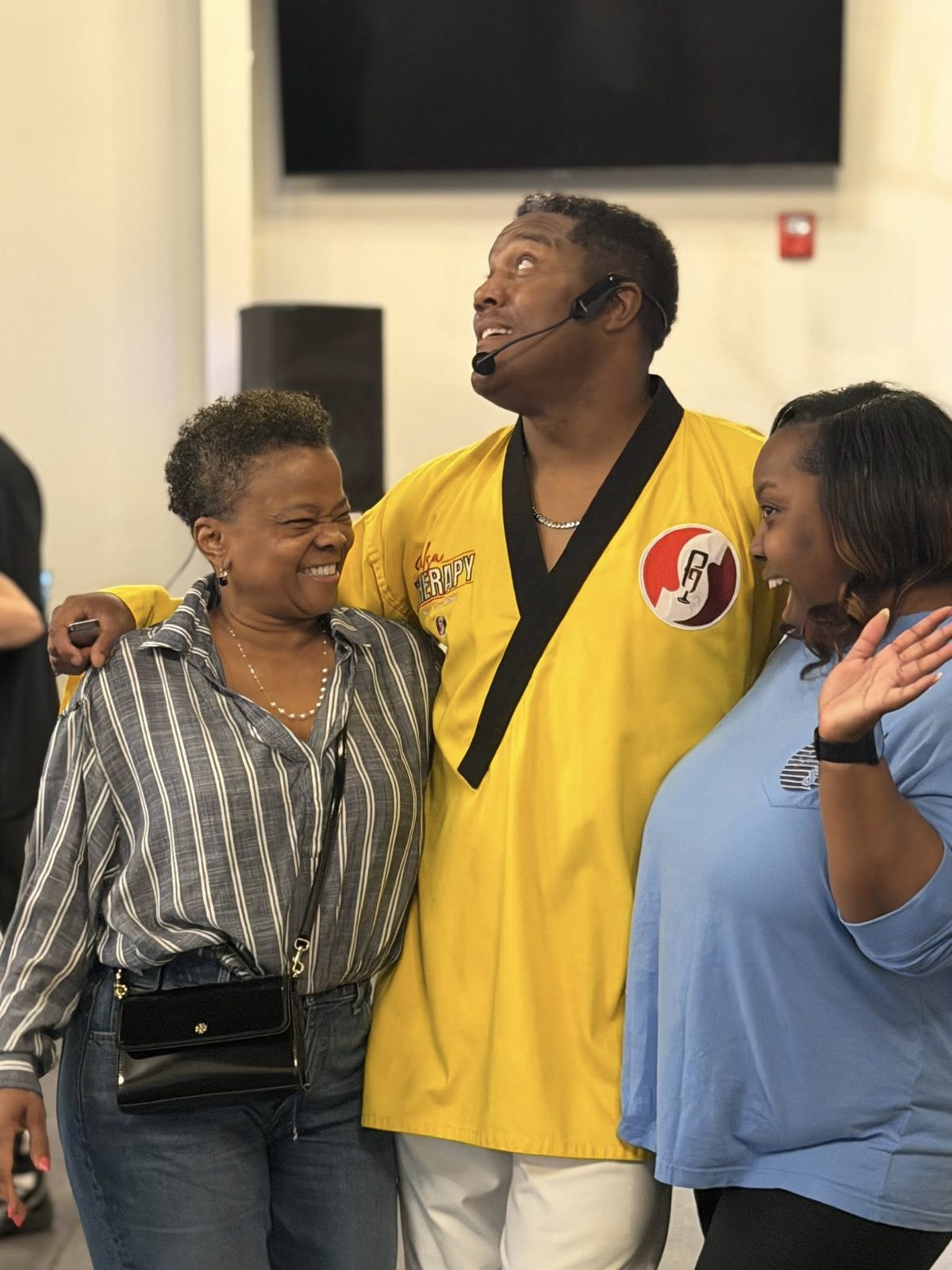 Stan Pearson embracing attendees at a Salsa Therapy event